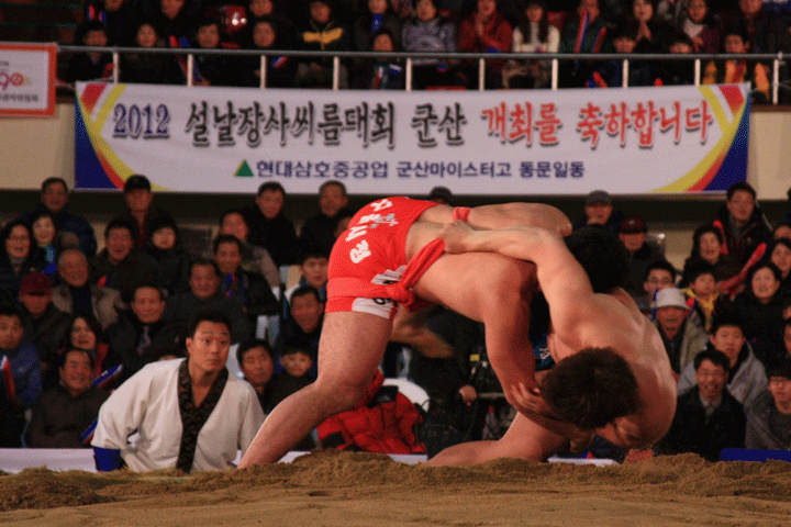 Two wrestlers battle it out at the 2012 Lunar New Year Ssireum Wrestling Tournament.