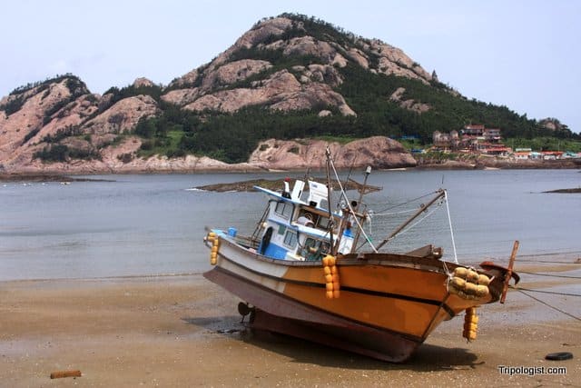 A fishing boat waits for high tide on Seonudo Island in South Korea.