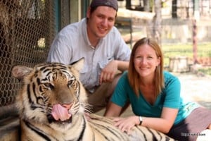 Posing with a two-year old tiger at Tiger Kingdom in Chiang Mai, Thailand.