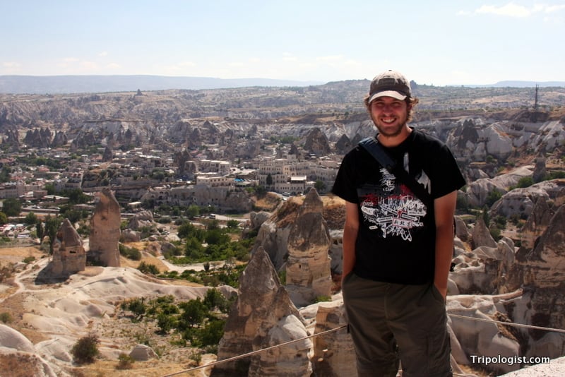 Standing on a cliff overlooking the fairy chimneys of Cappadocia.