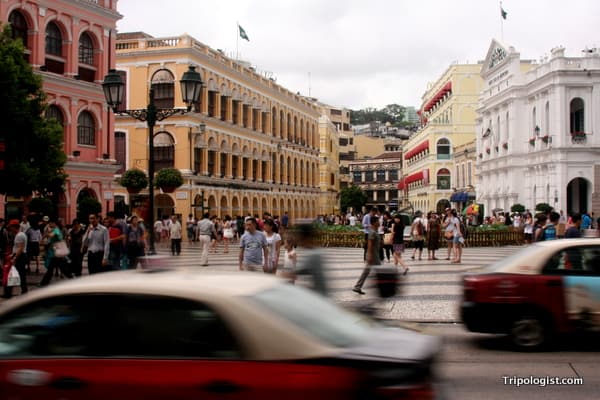 Cars and people move past Largo de Senado, a great starting point for any day trip to Macau.
